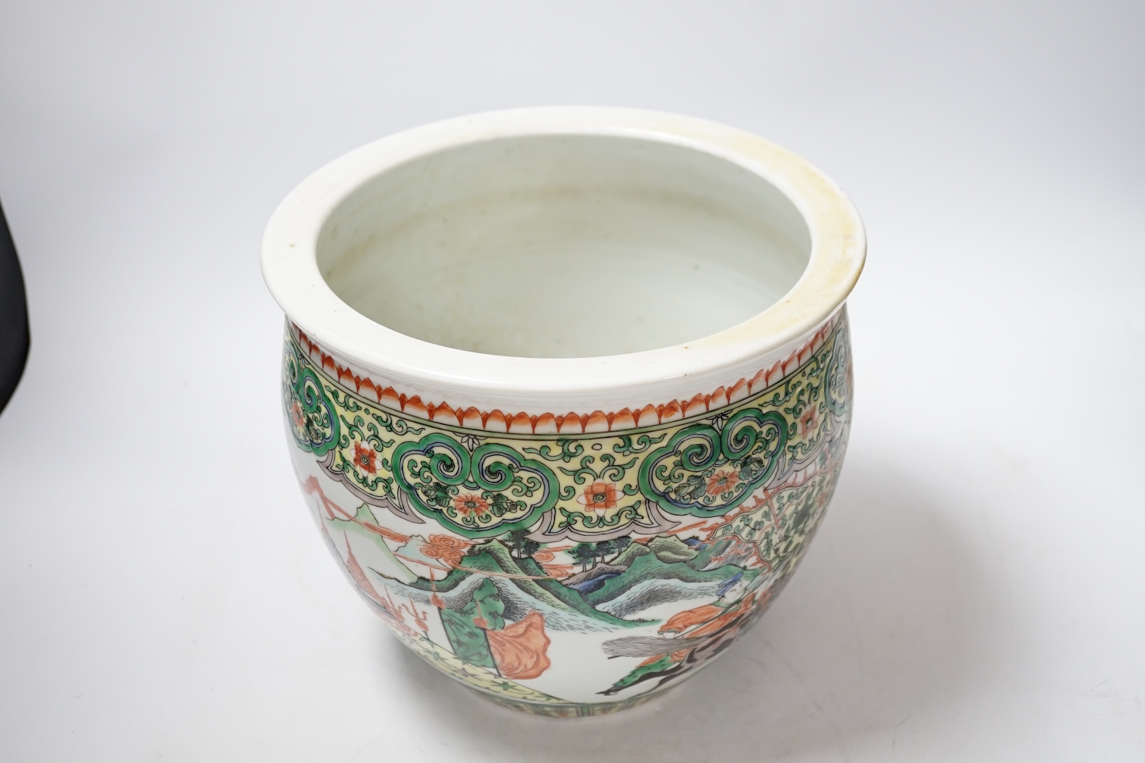 A 19th century Chinese famille verte ‘warriors’ jardiniere, 22.5cm high